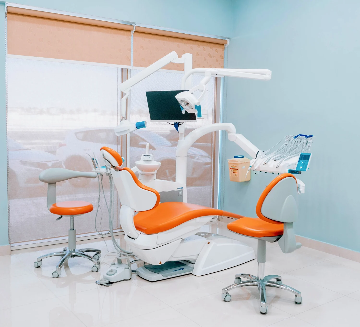 Dental treatment chair and ceiling-mounted TV